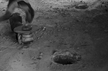 Working photo, detail of movement at work, hand movement, angle grinder, worker reaches for the equipment, hand in glove
