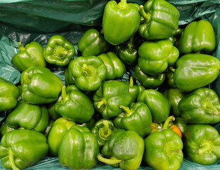Obraz na płótnie Canvas Green peppers on display at a market