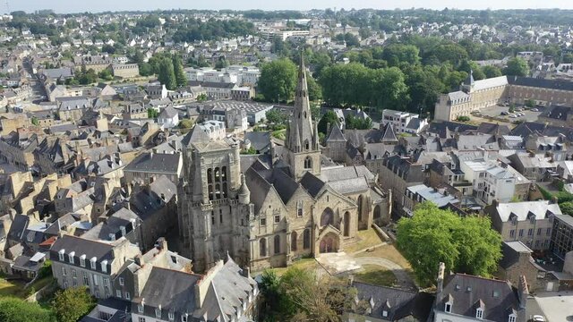 Aerial view of historic centre of Guingamp overlooking ancient Basilica of Notre Dame de Bon Secours, Brittany, France. High quality 4k footage