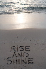 rise and shine on sand beach in sunrise at ocean or sea water waves, rise and shine
