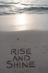 rise and shine on sand beach in sunrise at ocean or sea water waves, rise and shine