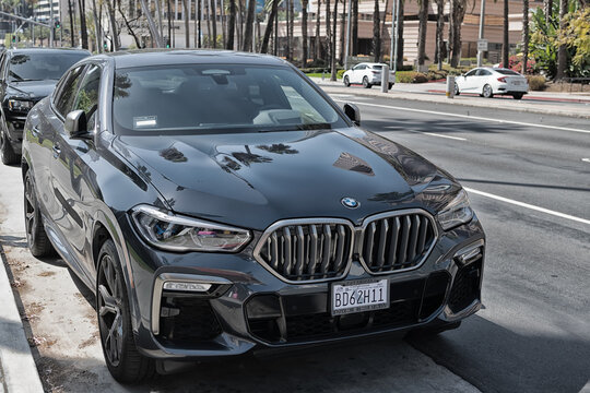 Long Beach, California USA - April 11, 2021: black bmw x6m competition luxury car. front view.