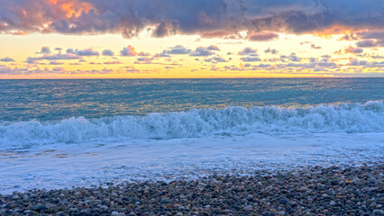 Seascape with waves and pink sunset