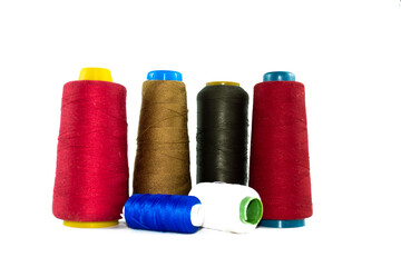 Spools of colors threads isolated on white background