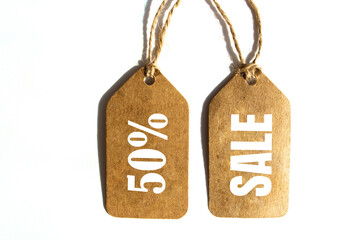 Big Sale 50% off price tag with brown string on white background