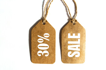 Big Sale 30% off price tag with brown string on white background