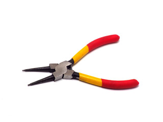 Fototapeta premium Picture of snap ring plier that has a yellow - red handle