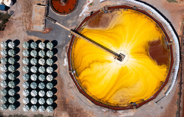 Aerial view of industrial mixing machine at Hutt Lagoon or Pink Lake near Port Gregory in Western Australia, color created naturally by bacteria and harvested in ponds by BASF for beta-carotene