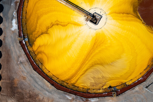 Aerial view of industrial mixing machine at Hutt Lagoon or Pink Lake near Port Gregory in Western Australia, color created naturally by bacteria and harvested in ponds by BASF for beta-carotene