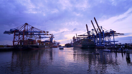 Naklejka na ściany i meble Sunset over the port of Hamburg - travel photography