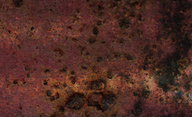 image of rusty on the surface of an old iron plate. Building surface that has been exposed to environmental conditions for a very long time causing corrosion from rust.