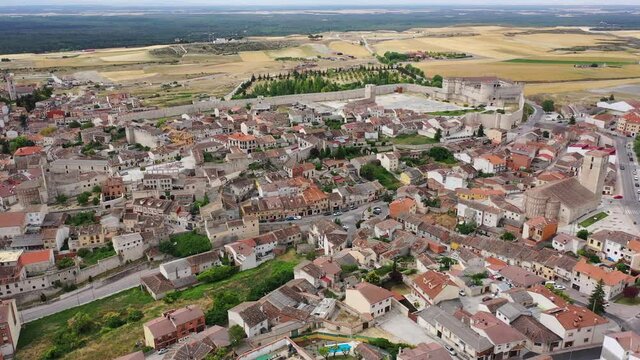  Scenic view from drone of Cuellar cityscape with medieval Castle of Dukes of Alburquerque, Spain