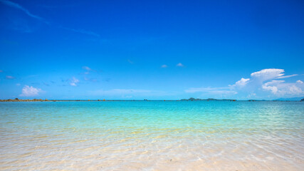beach with blue sky and clouds