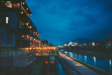Fototapeta na wymiar Promenade at night along Kamo River, Kyoto, Japan.