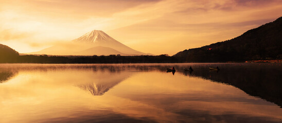 Mount fuji from Shoji lake with fishing boat at sunrise