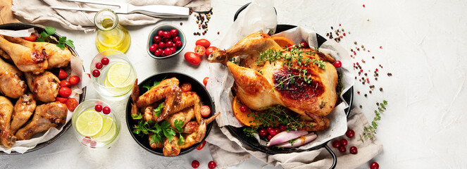 Assorted grilled chicken meat and sauce on gray background. Homemade food concept.