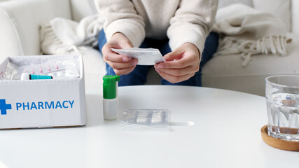 Asian woman receive medication package box free first aid kit from pharmacy hospital delivery...