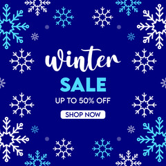 Fototapeta na wymiar Winter sale text promo with white and blue snowflakes element in dark blue background, winter season advertising concept