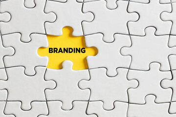 Fototapeta premium The word branding on missing puzzle piece. Brand identity and recognition