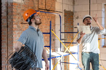 Two builders collaborate to build a new home.