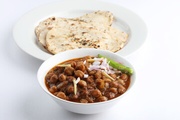 Chole or Chana Masala or Spicy Chickpeas is traditional North Indian main course recipe and usually served with Bhatura or Roti,Naan