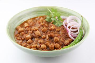 Pindi Chole Kulche or road side choley Kulcha popular in India and pakistan is a popular street food. It's a spicy Chickpea or chana curry served with Indian Flat Bread. Chole masala 