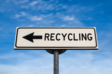 Recycling road sign, arrow on blue sky background. One way blank road sign with copy space. Arrow on a pole pointing in one direction.