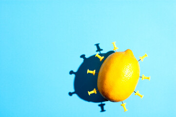A simple creative object made of lemon and paper pins. Minimalist concept with free copy paste...