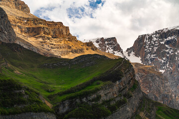 Mountain peak is covered with snow at summer