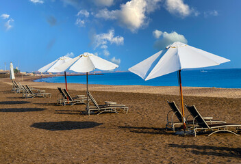 beach chairs and umbrella