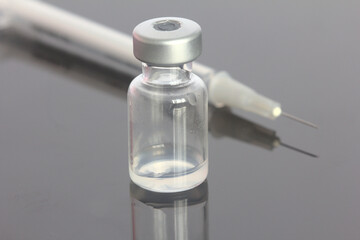 Covid19 Vaccine vial with needle and syringe