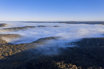 Drone aerial photograph of fog in a large valley in regional Australia