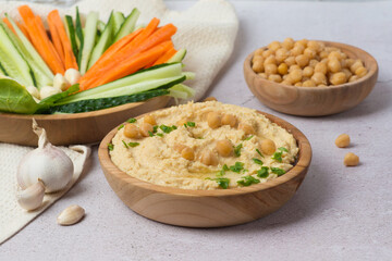 Hummus in metal bowl. Selective focus.
