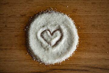 Drawn Heart in a pile of sugar 