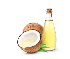 Coconut oil dripping from coconut cut in half with bottle  isolated on white background.