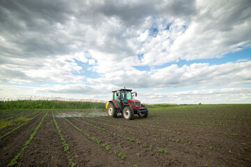 Spraying pesticides at soy bean fields