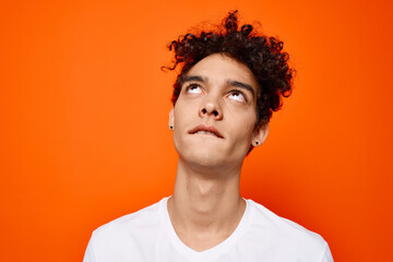 guy in white t-shirt curly hair cropped view studio