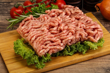 Raw pork minced meat over board