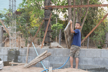 Concept of poverty and child labor, Children who are working on construction sites , Against child...