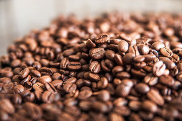 Coffee background close-up macro. Lots of coffee beans and copy space.