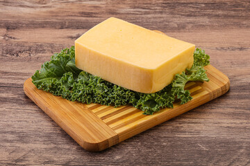 Tasty yelloow Tilsiter cheese brick