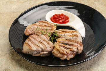 Grilled pork tenderlion with tomato sauce