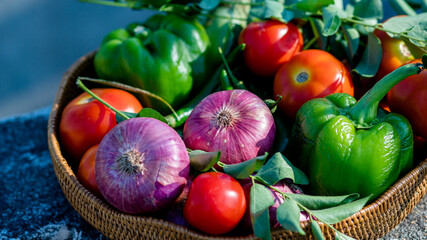 Farm fresh vegetables in soaking sun, onion, tomato, curry leaves, capsicum, carrot
