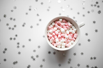Fototapeta na wymiar large white cup with marshmallows top view