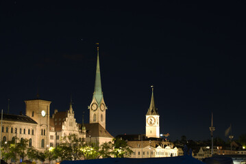 Old town of Zurich at nicht with churches Fraumünster (woman's minster) and Sankt Peter (saint peter). Photo taken May 29th, 2021, Zurich, Switzerland.