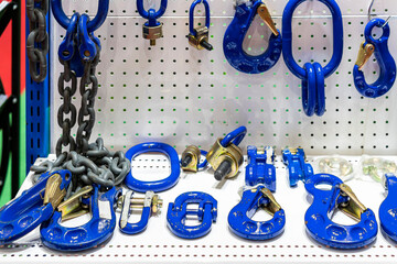 various type of metal or steel lifting hook chain and accessories such as master link shackle screw pin hammerlock connector for hoist crane in industrial place or store on shelf - obrazy, fototapety, plakaty