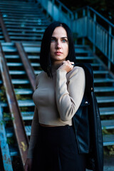 Beautiful woman evening portrait in the city