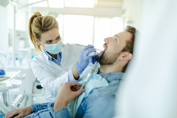 Young man visit dentistry clinic for professional teeth treatment.