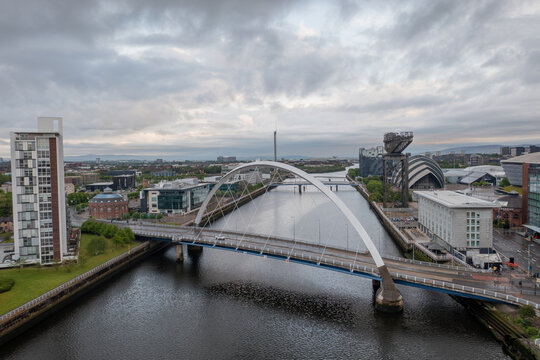 Glasgow city centre river Clyde with crane, TV buildings, Scottish Exhibition and Conference Centre and dock crane. Aerial image of the COP26 venue
