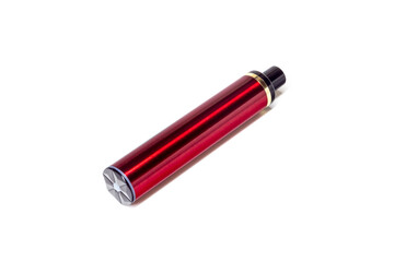 Disposable e-cigarette in dark red color on white isolated background. The concept of modern smoking, vaping and nicotine. Top view